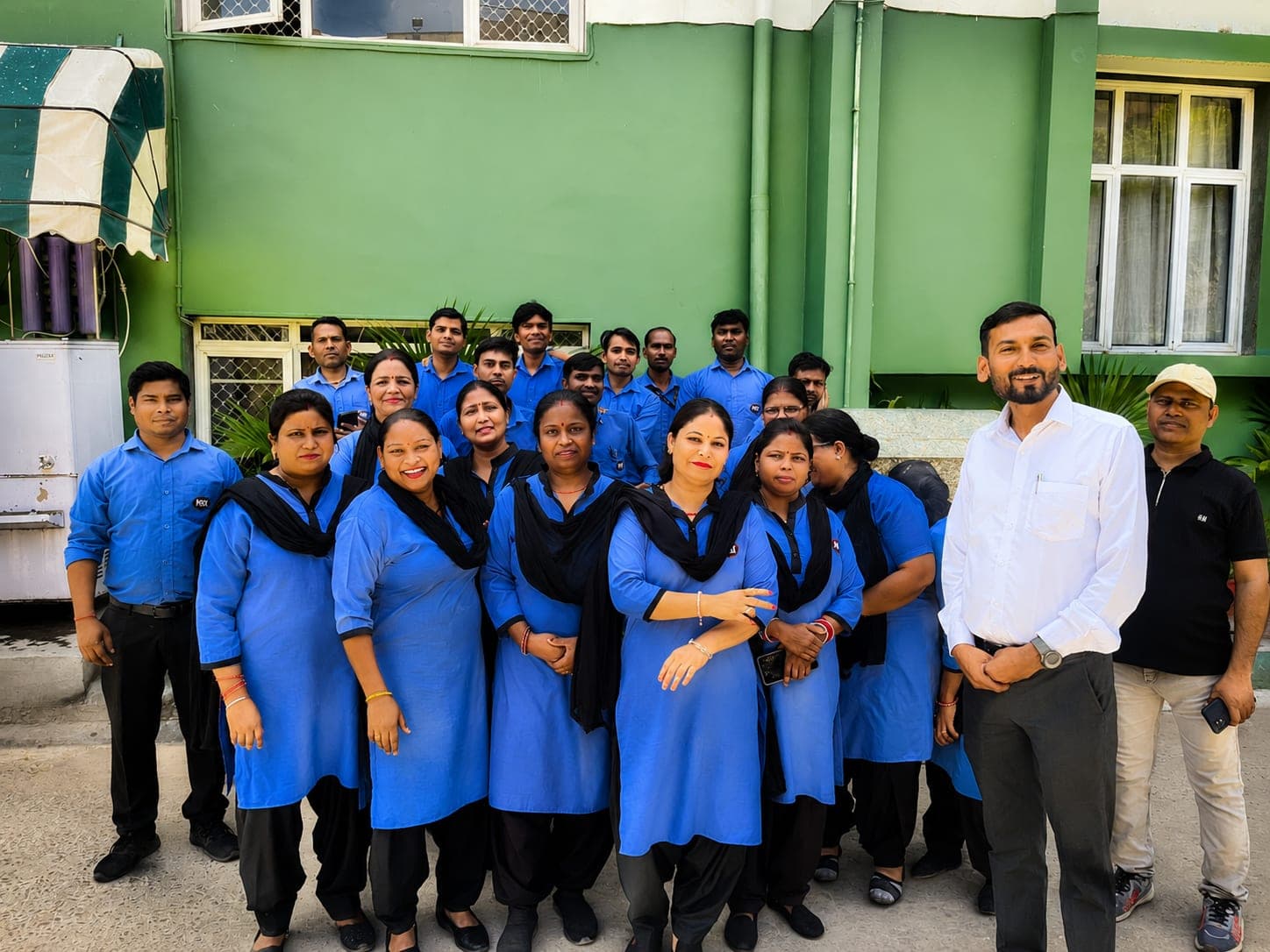 The MITRA housekeeping and facility team with their supervisor at a client site